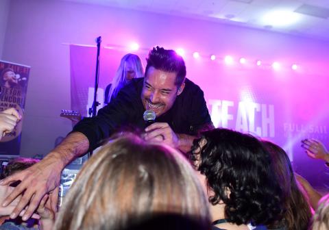 Singer, songwriter and music video star Adam Calvert reaches out to an audience of Hackleburg High School students late last year during a concert in the school gym planned and executed by Family, Career & Community Leaders of America students and their teacher, Holly Chambers. 