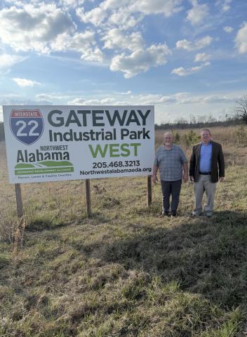 Brilliant Mayor Perry Franks (left) is shown with C3 of Northwest Alabama Economic Development Alliance President and CEO Tom Wisemiller in front of the Gateway I-22 Industrial Park West, where more than $470,000 in SEEDS monies will soon fund clearing and grading, followed by the construction of a 50,000-square-foot building pad. Photo courtesy of Brilliant Police Department Chief Skylar Handley.