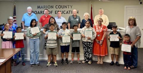 Shown at the Sept. 15 Marion County Board of Education meeting are ELL students who were recognized. Front row, from left, are Edalys Cintron Vega, Jose Cintron Vega, Evelin Rivera-Fernandez, Pedro Torres, Alejandro Tellez, David Sanchez-Ramirez, Kimberly Rivera, Jose Perez Hilario and Michael Lian; second row, same order, EL specialists Reba Hill, Ana Colburn, Vickie Johnson and Charlotte Howell; third row, same order, BOE members Mark Dearen, Dr. Alex Smith, Tim Bryant, Daryl Weatherly, Joyce Fowler and s