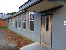 There appears to be rotten wood on the door to the band room at Phillips High School.