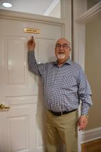 Standing outside the office he'll remain in for five more months, Hamilton Bob Page is all smiles after making his announcement during a city council meeting that he'll not run again for re-election.