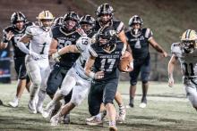 Winfield’s Declan Morgan (#17) out-rushes the Gordo defense.