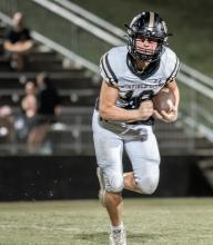 Blaine Bowen looks ahead while rushing.