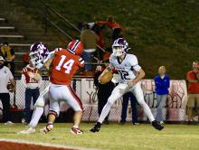 Hamilton’s Brady Cantrell makes his next move while his teammate blocks for him.